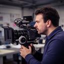 Kiernan Davern operating a cinema camera at an East Midlands business shoot